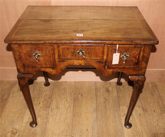 An early 18th century walnut lowboy, W.77cms